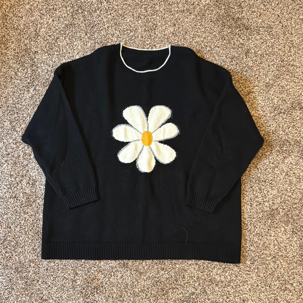 BloomChic Black and White Crew Neck Sweater with Bold Floral Design